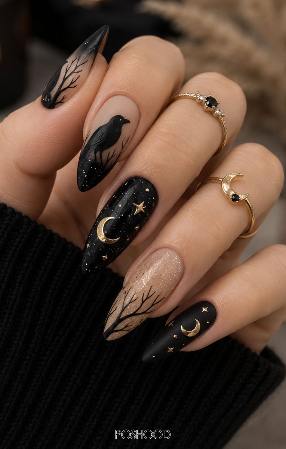 Glossy nude almond-shaped Halloween nails decorated with black witch hats, gold crescent moons, stars, and glitter accents.