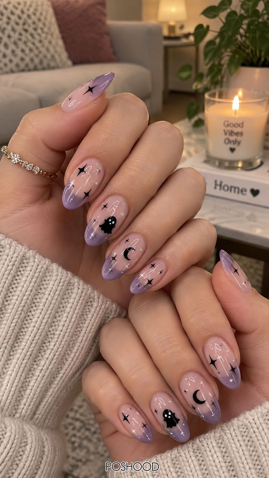 Cute Halloween nails ideas featuring lavender ombre tips, black ghosts, crescent moons, and star nail art on almond-shaped nails.