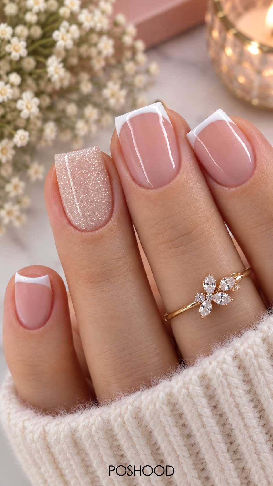 Nude pink French tip nails with crisp white tips and a sparkling glitter accent nail